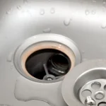 silvery-kitchen-sink-with-a-disassembled-protectiv-2023-11-27-05-15-56-utc.jpg
